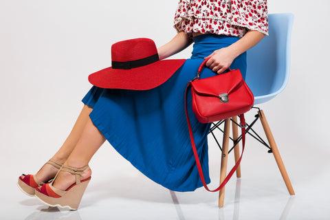 women-on-chair-with-tote-bags